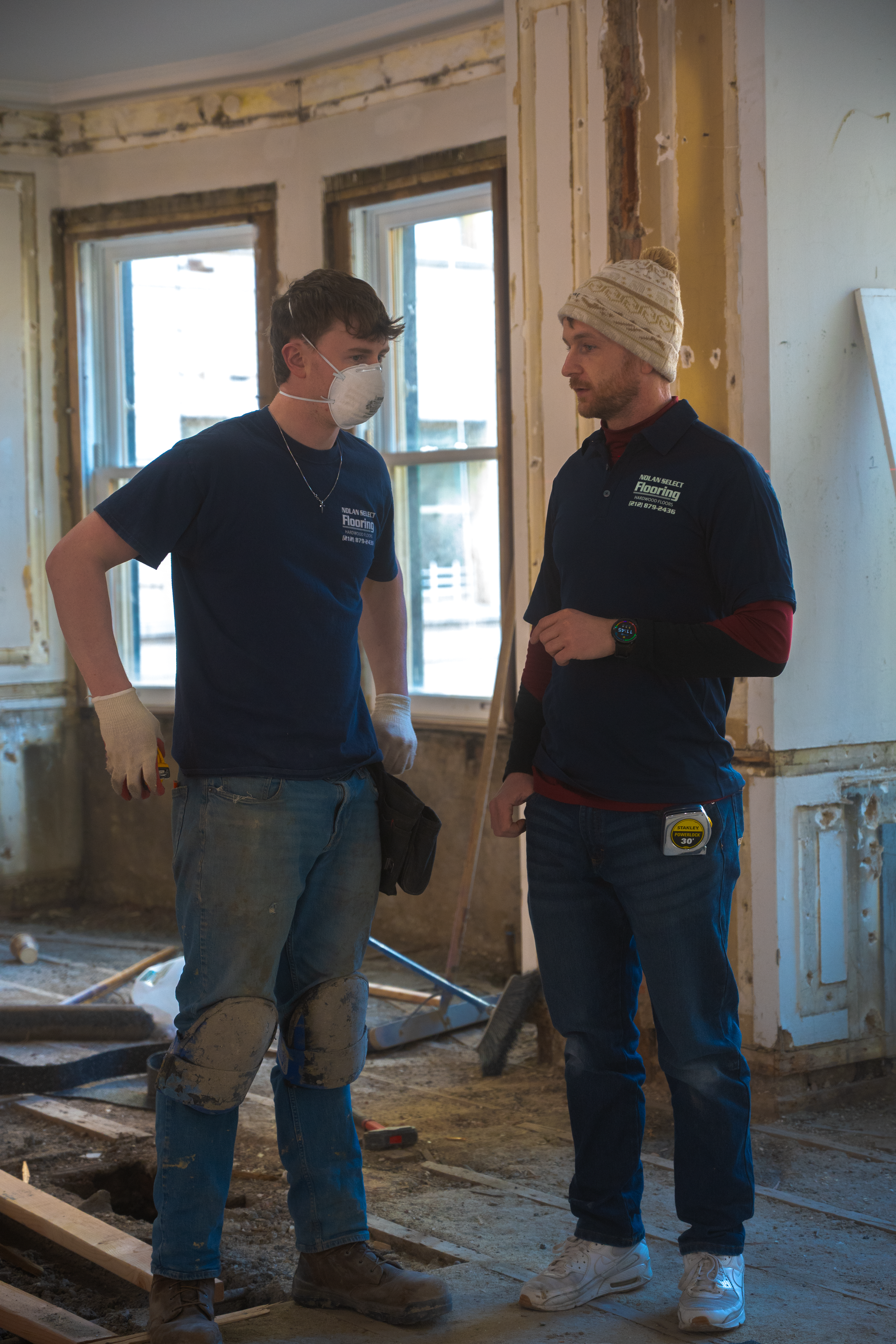 Two Nolan team members discussing work on site