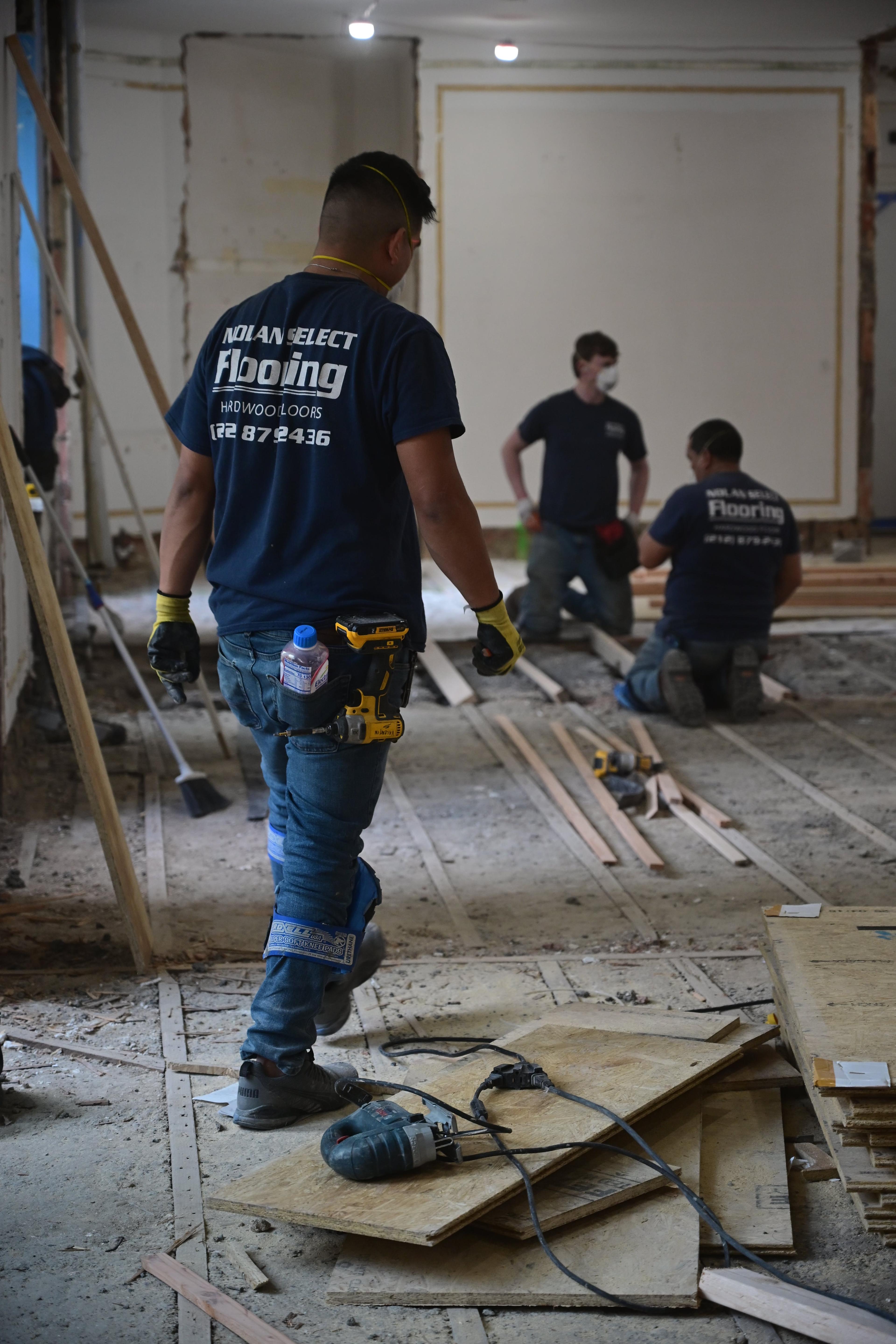 Nolan crew preparing a subfloor on a New York job site