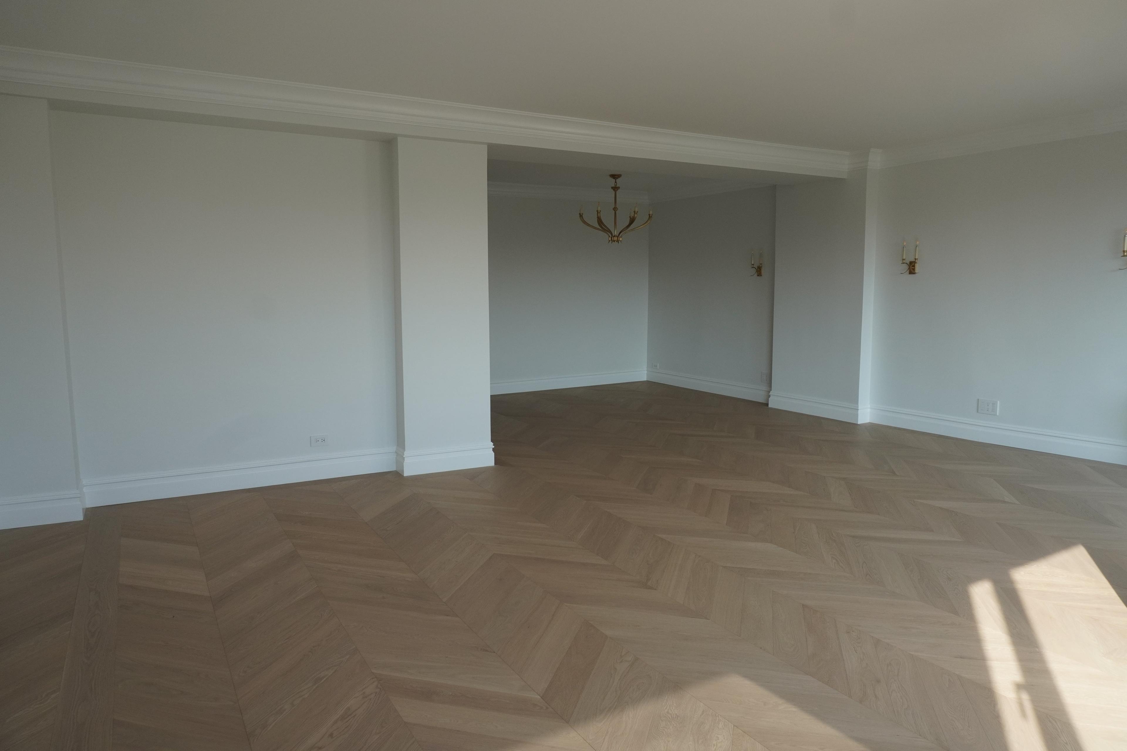 Finished chevron floor in a second room at 116 Central Park South