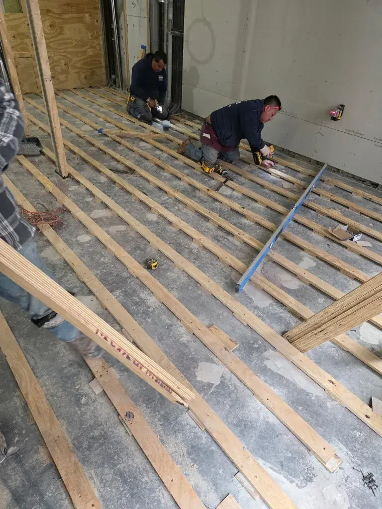 Nolan crew preparing a subfloor on a New York job site