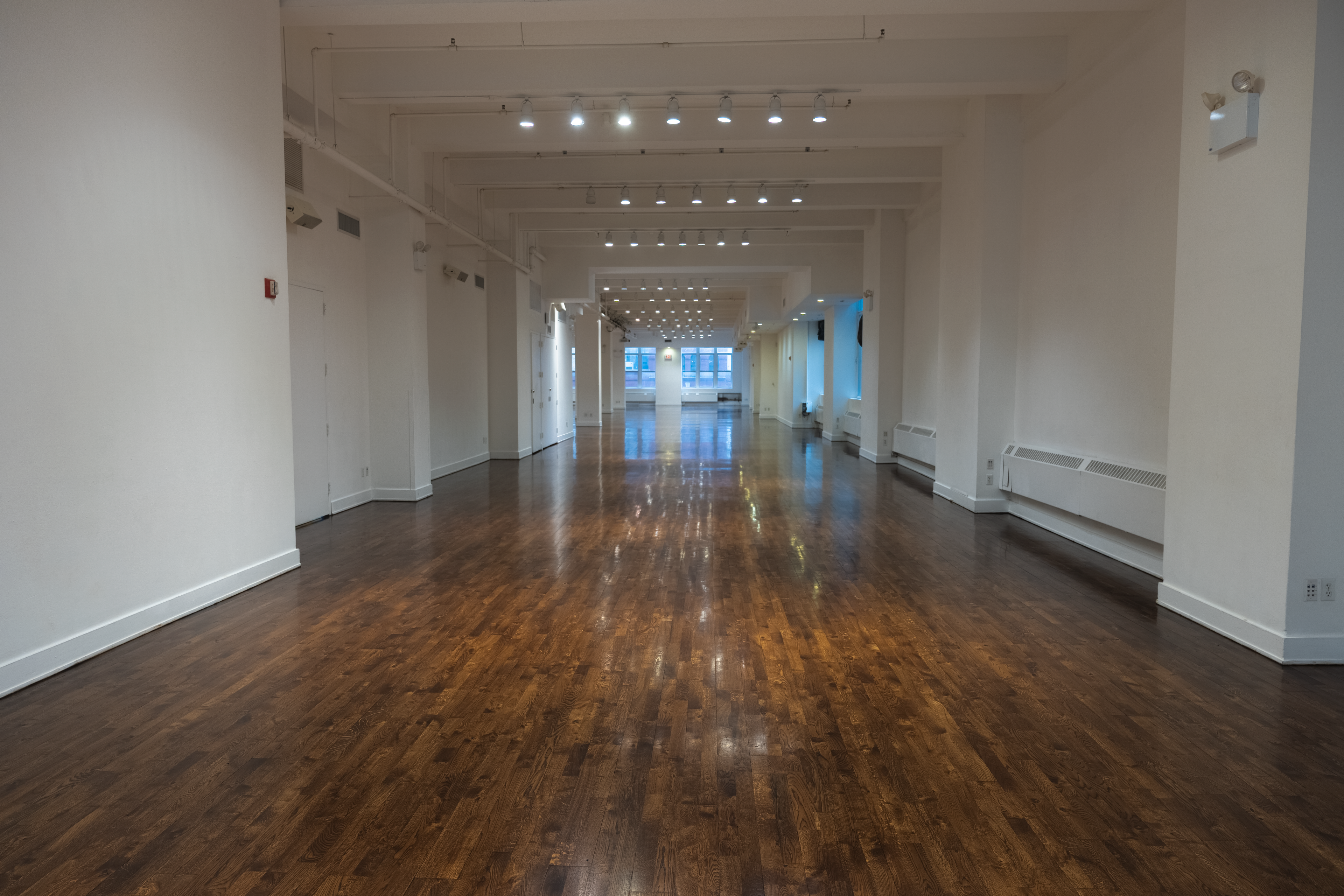 Completed hardwood floor looking down the hall at Metropolitian Pavilion