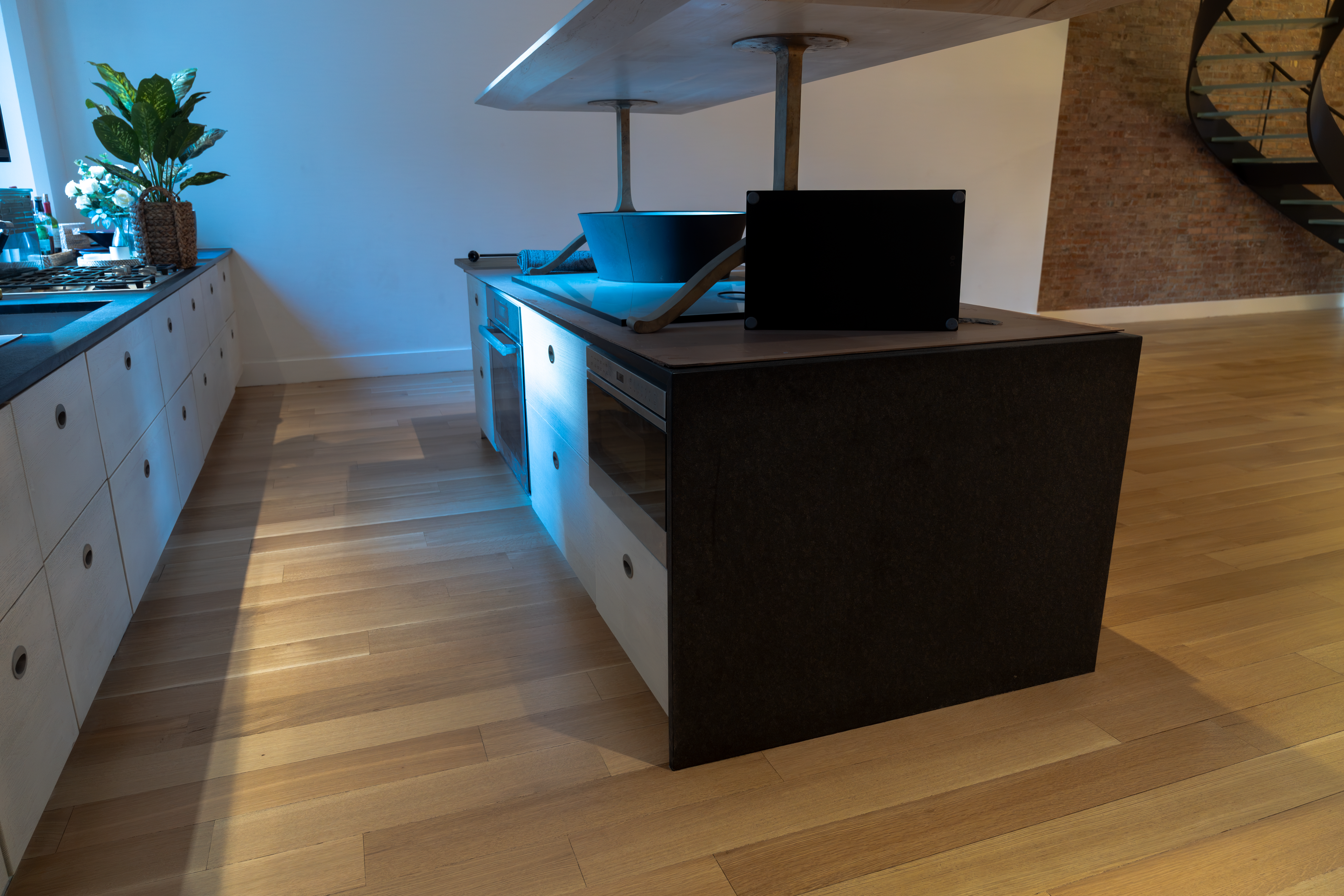Hardwood floor at the kitchen and spiral stair at Wooster St